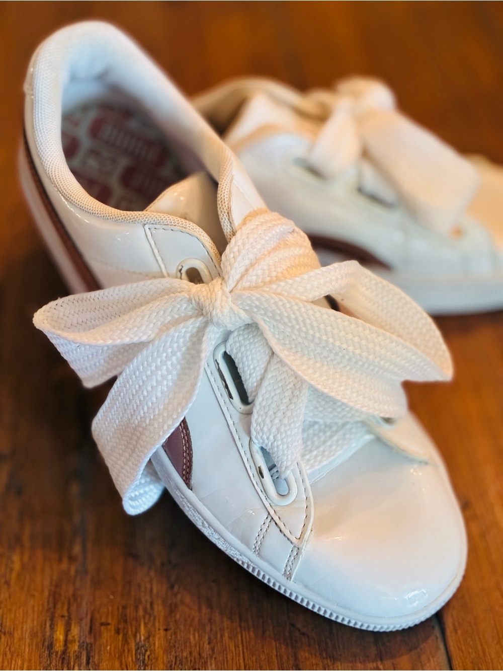 Puma Heart Basket women's sneakers in white patent and rose gold striping. Sz 9
